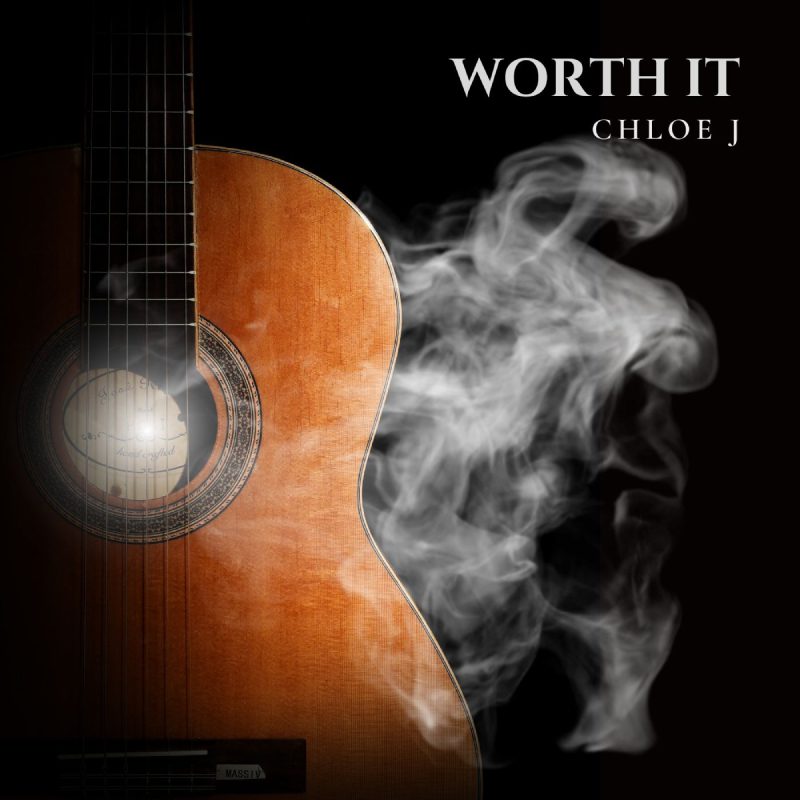 A guitar with smoke coming out of it.